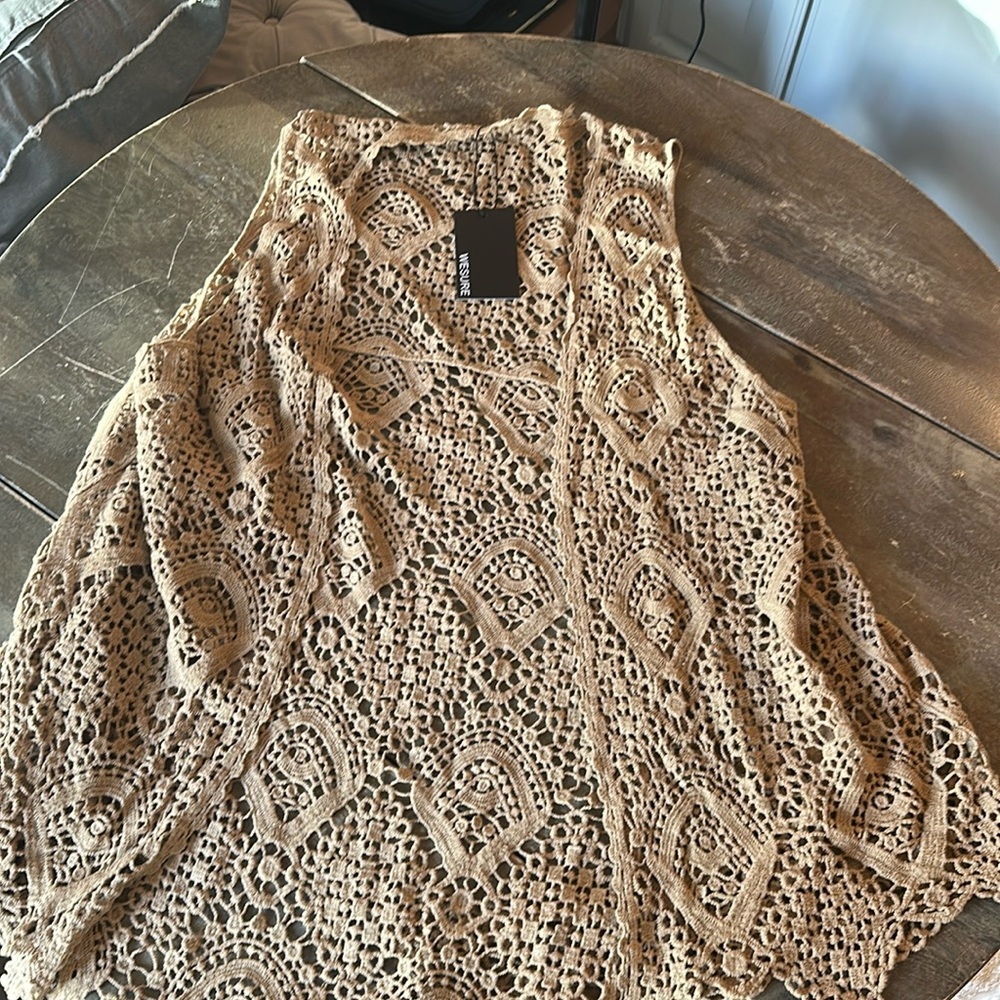 Tag still attached knitted vest with pretty design